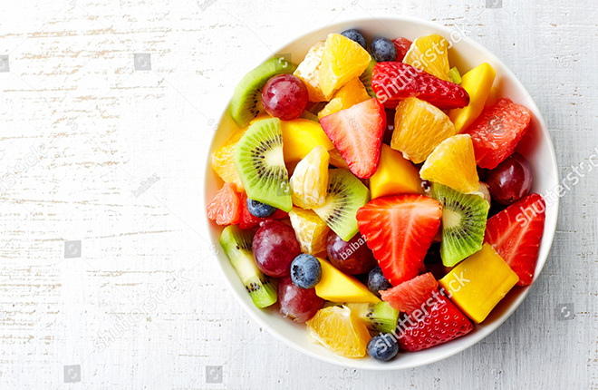 stock-photo-bowl-of-healthy-fresh-fruit-salad-on-wooden-background-top-view-264191042.png